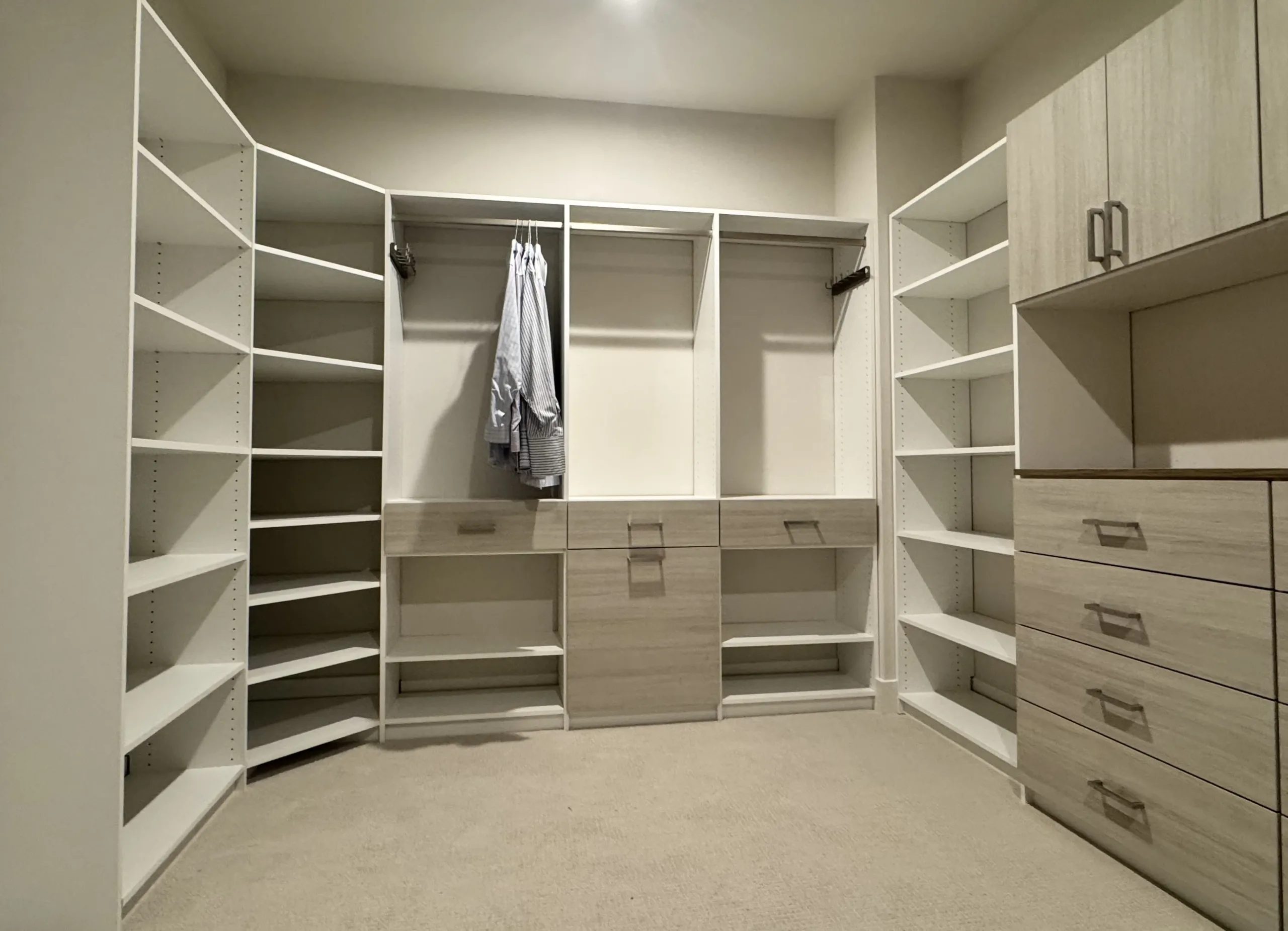 walk in closet with laundry hamper